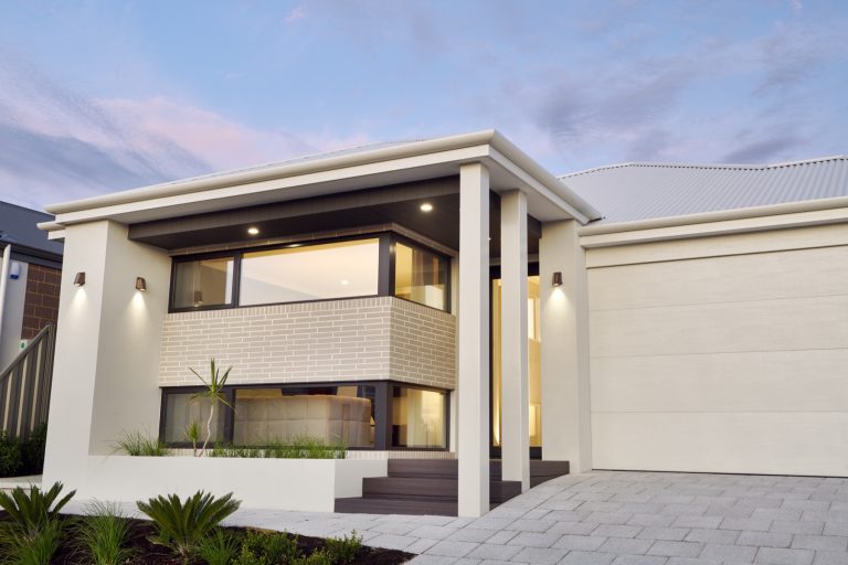 Contemporary home exterior with large black-framed windows.