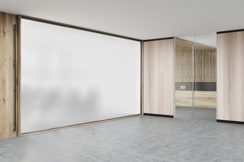 ToughSwitch privacy glass in opaque mode enclosing a meeting room.