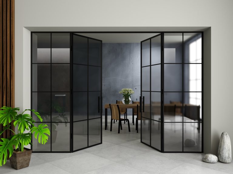 Dark grey toughened glass pivot doors in a contemporary interior