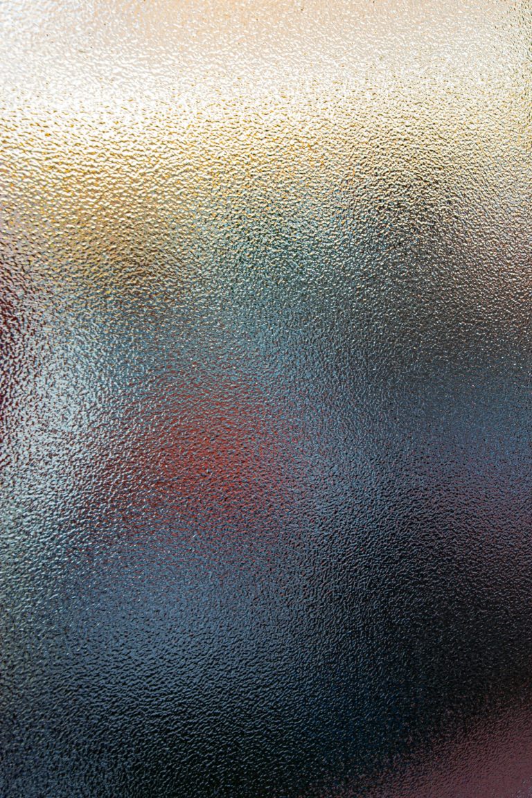 Spotswood pattern glass scattering warm and cool coloured light