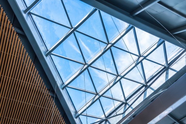 Triangulated laminated glass roof over a commercial atrium